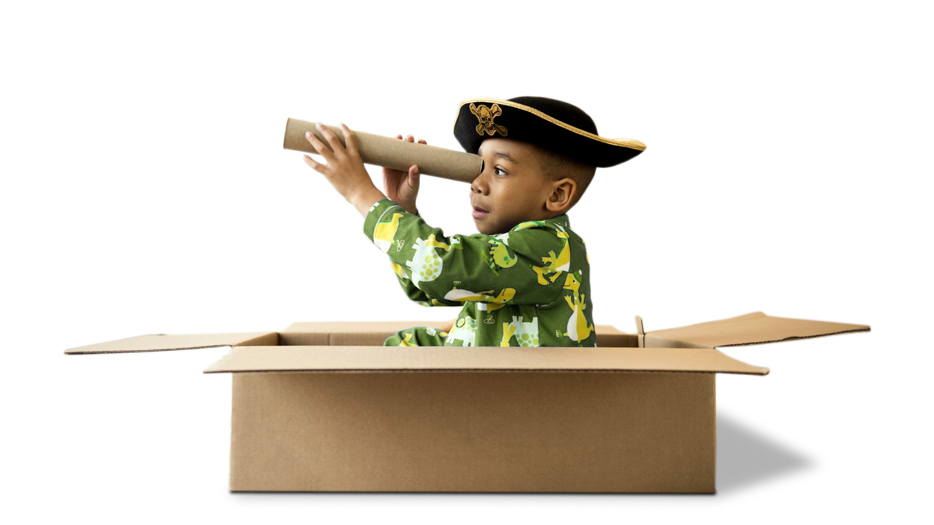 Boy playing in a cardboard box